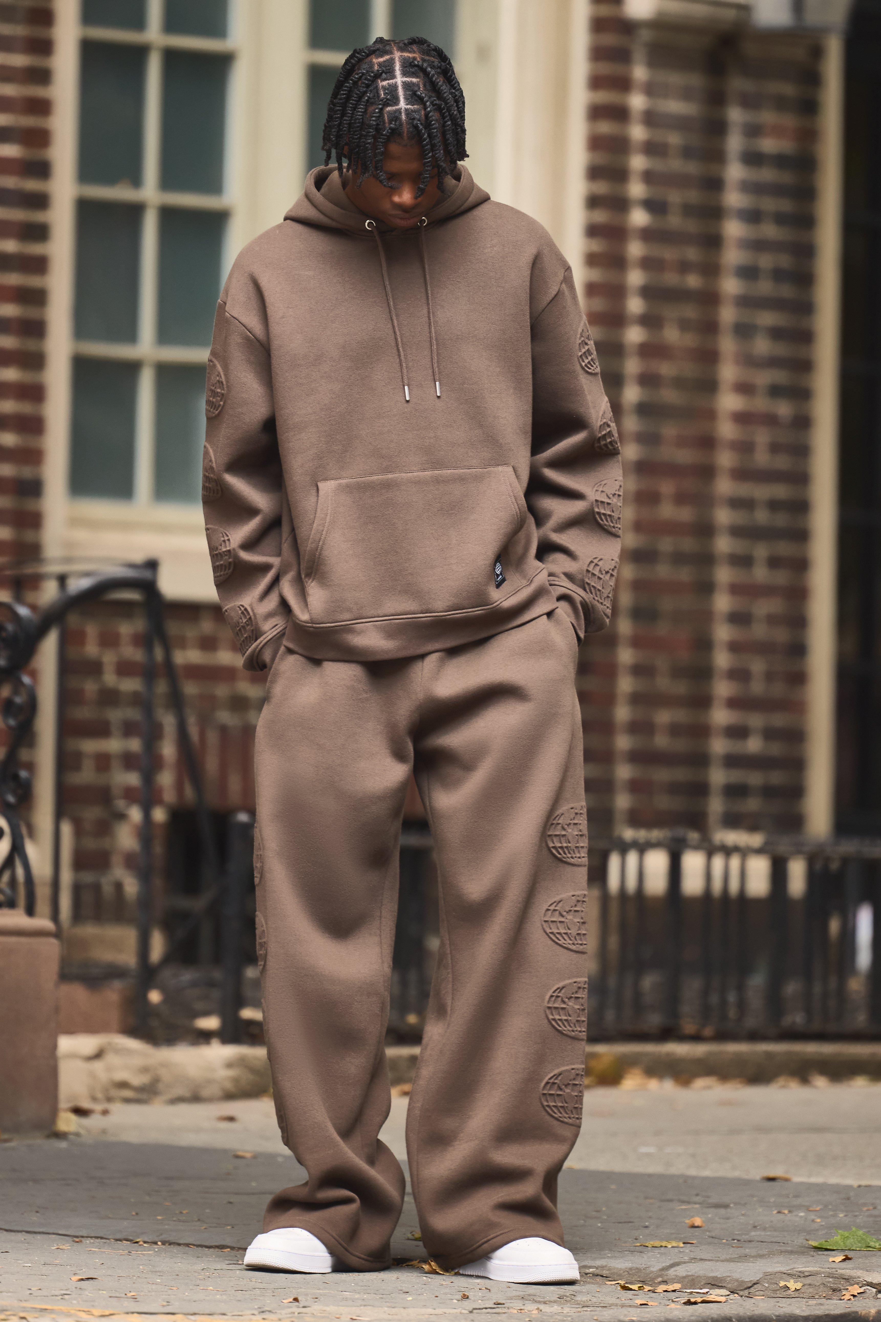Mens Brown Oversized Boxy Worldwide Debossed Wide Leg Tracksuit, Brown